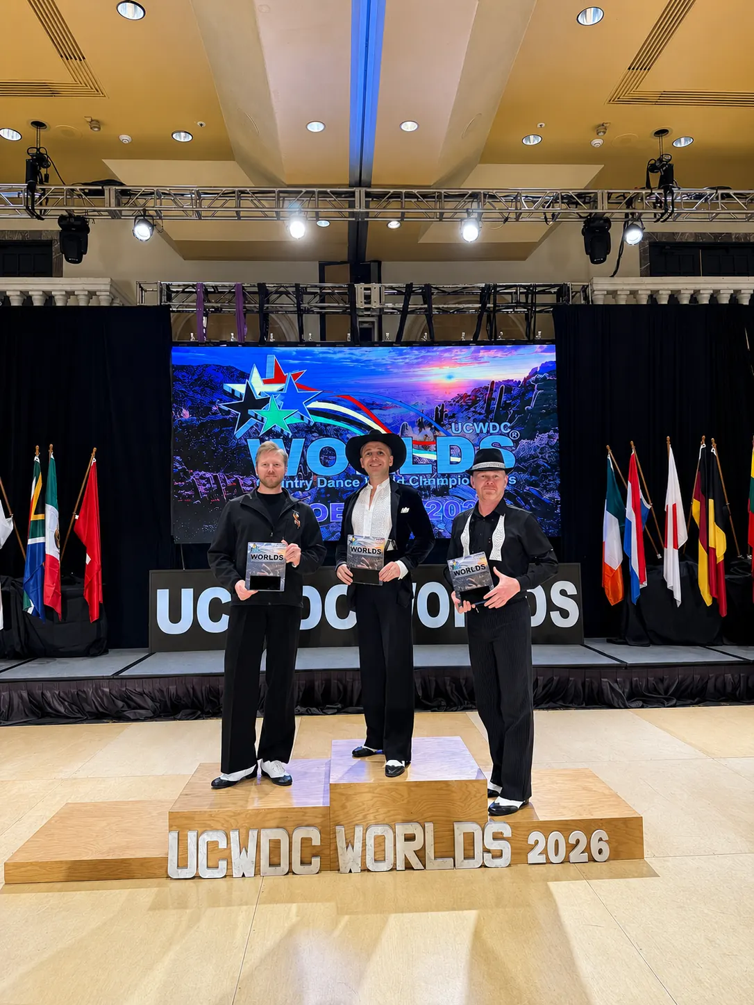 Grigol Kranz, 2026 UCWDC Advanced Country Line Dance World Champion, on the awards podium