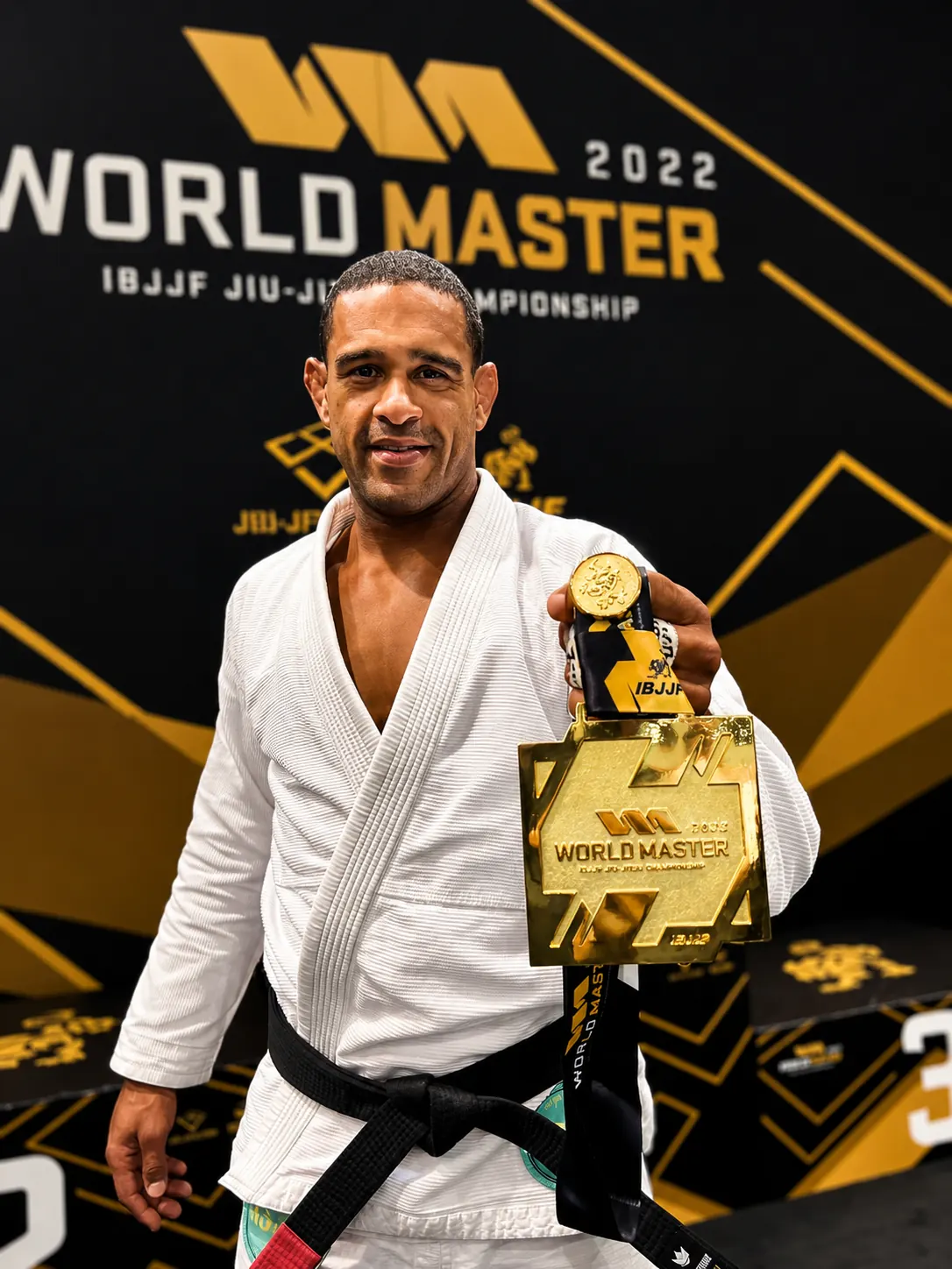 Jorge Santigo, IBJJF World Master BJJ Champion and former MMA fighter, holding his gold medal